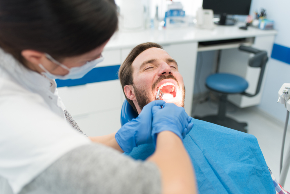 Man getting his tooth pulled