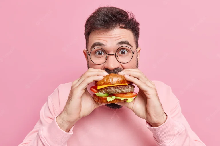 man-eating-burger-affecting-oral-health
