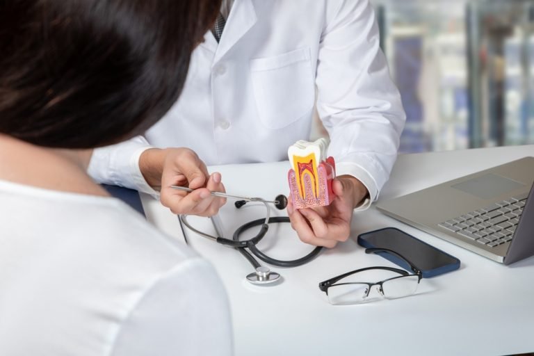 dentist explaining root canal treatment procedure