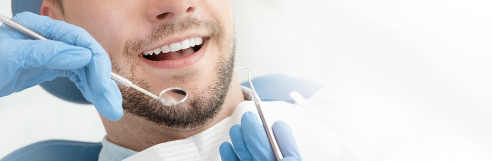 Young,Man,At,The,Dentist.,Dental,Care,,Taking,Care,Of